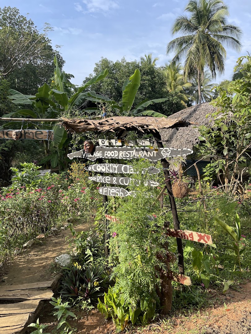 Leafy garden path leading to the Gami Taste entrance